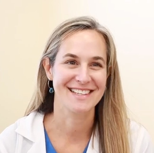 Facial treatment in progress with laser device.